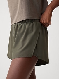 View large product image 4 of 14. GapFit Mid Rise Dolphin Running Shorts