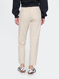 View large product image 4 of 15. GapFit High Rise Downtown Runaround Pants